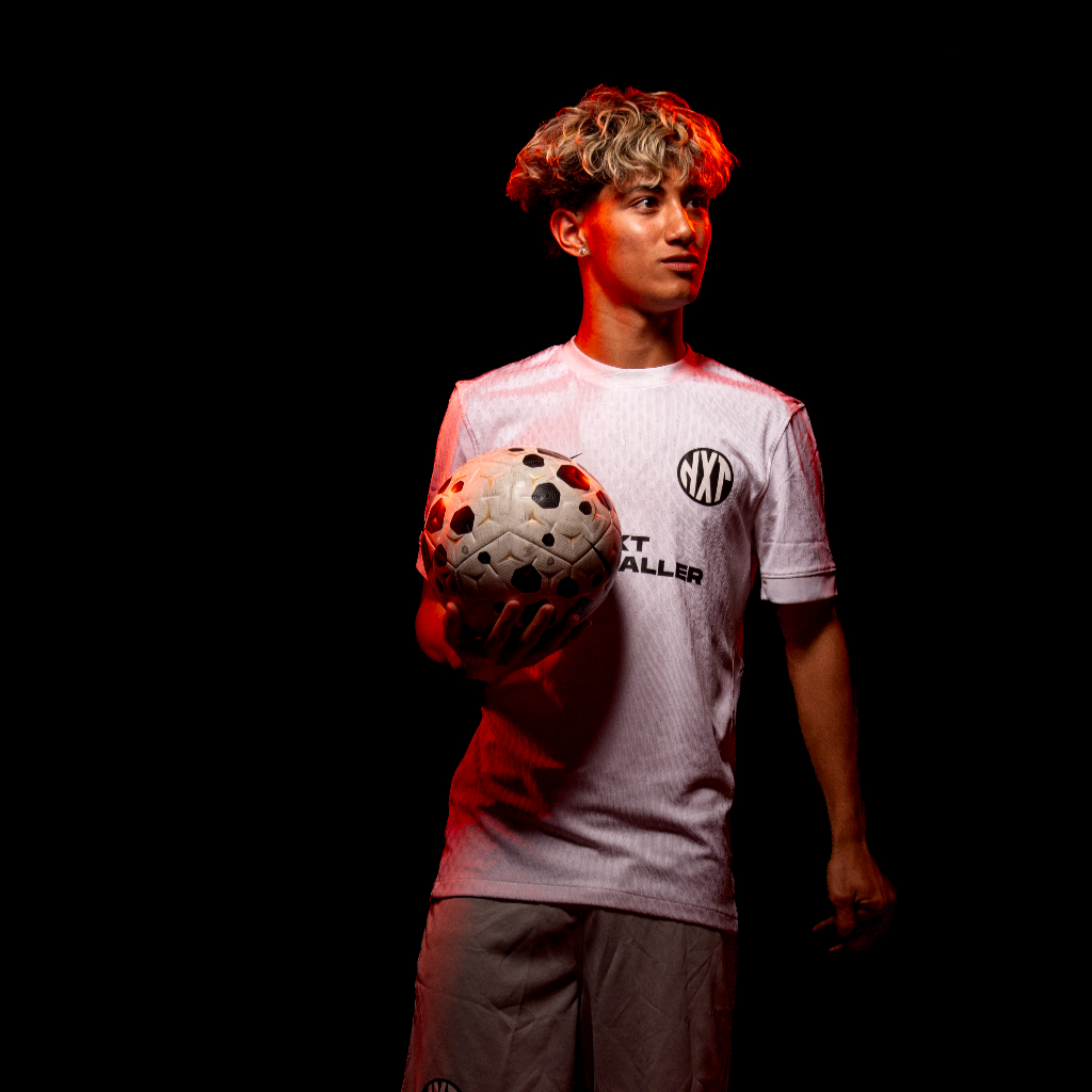 NXT footballer holding ball