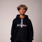 NXT footballer in hoodie