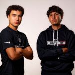 2 NXT footballers standing