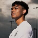 NXT Footballer standing smiling