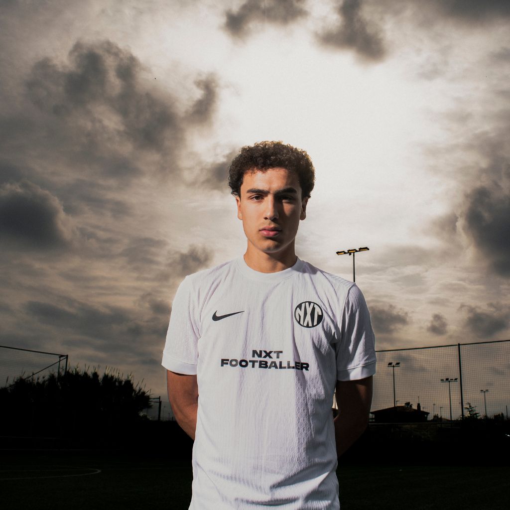 NXT footballer in white uniform outdoor