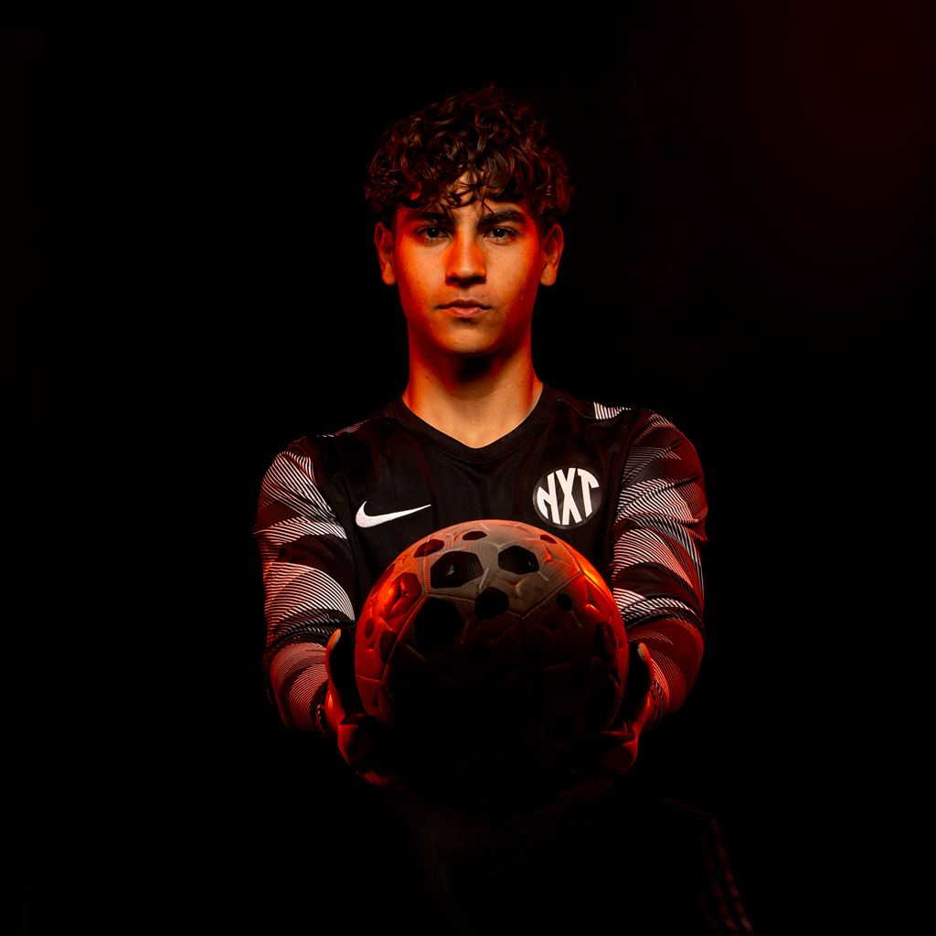 NXT football goalie holding football