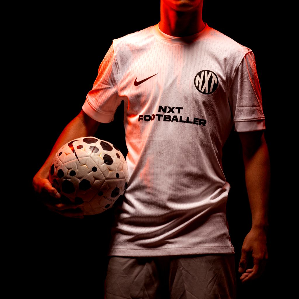 NXT footballer holding football