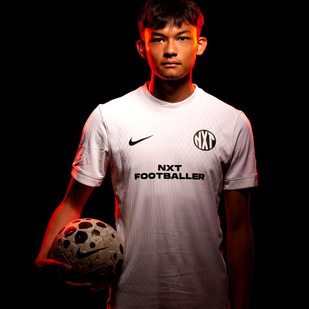 NXT footballer holding ball