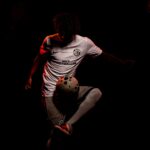 NXT footballer kicking ball up