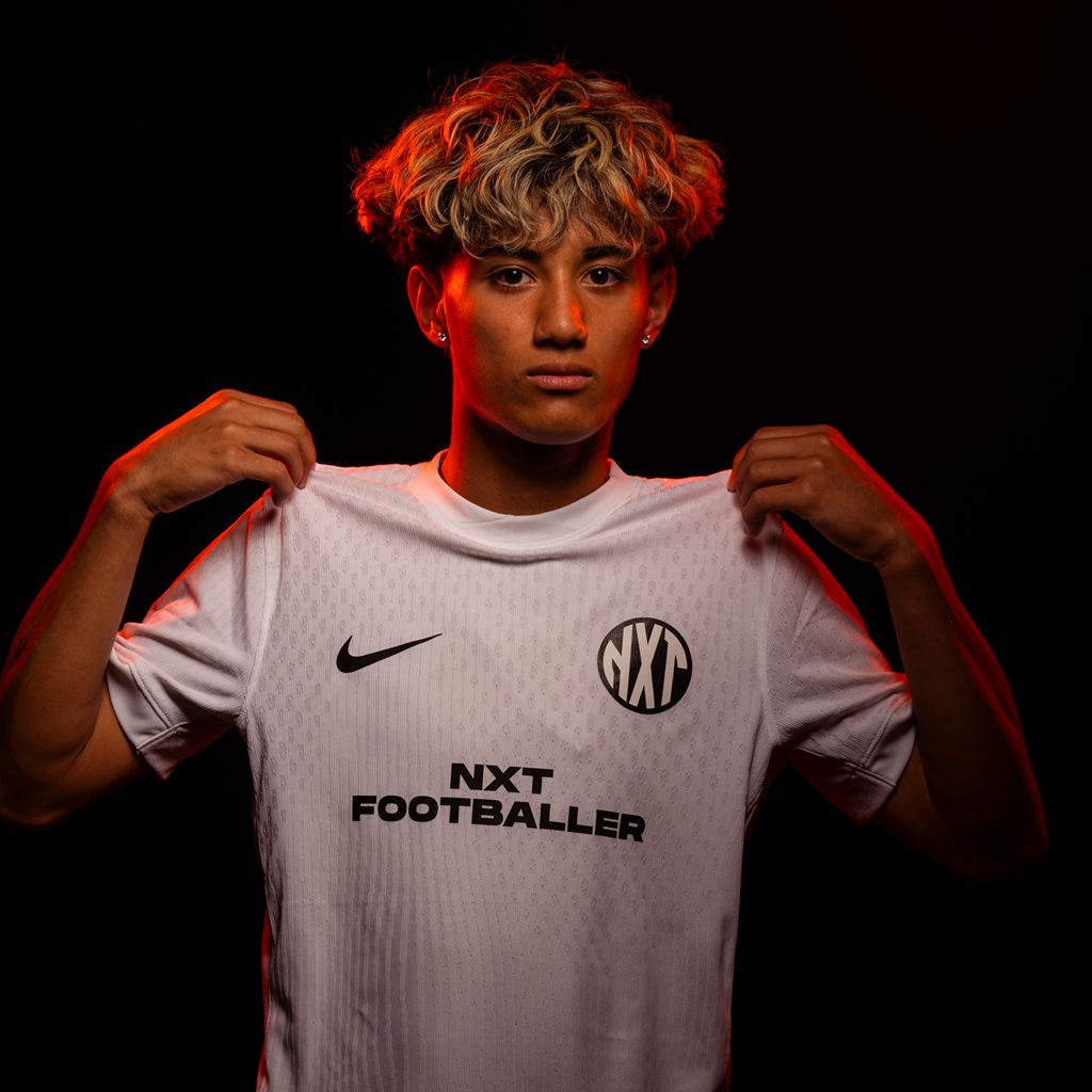 NXT footballer holding uniform