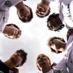 NXT footballers huddle