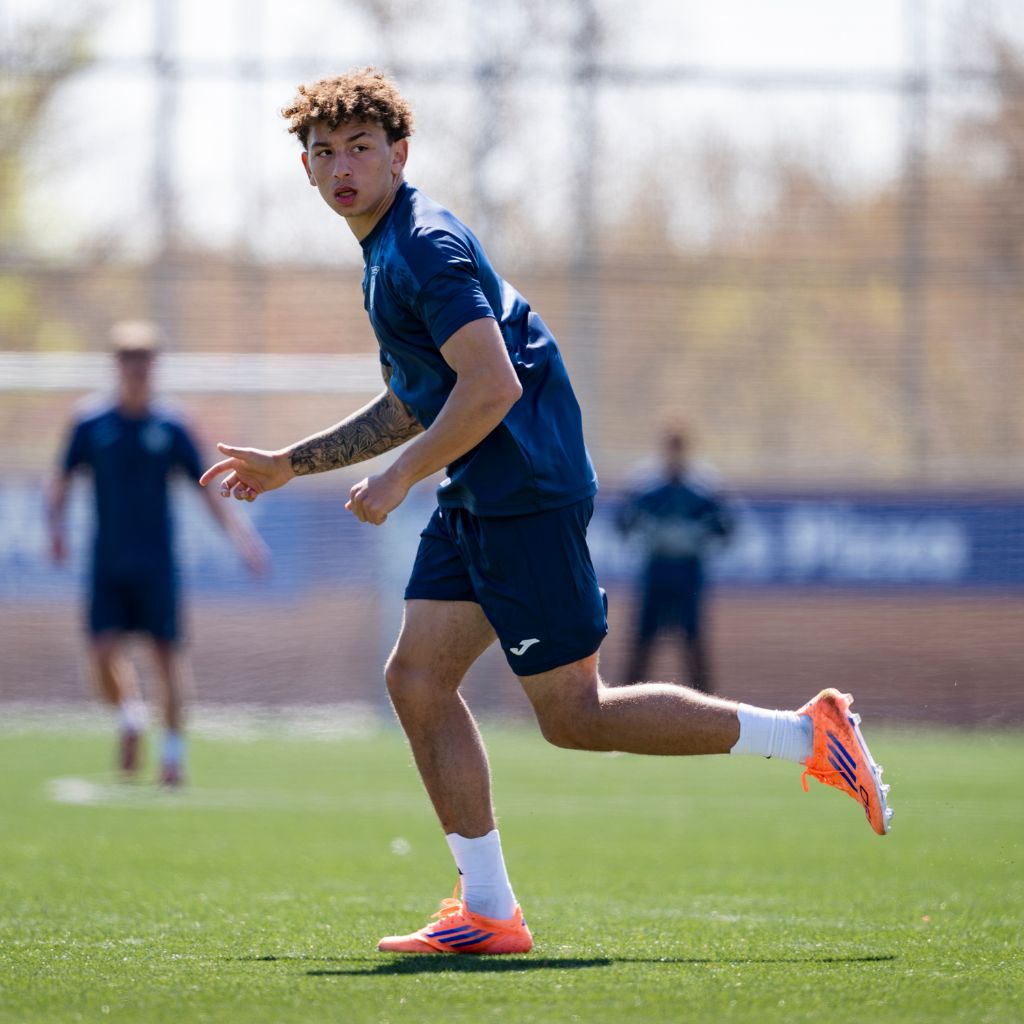 NXT footballer running on field