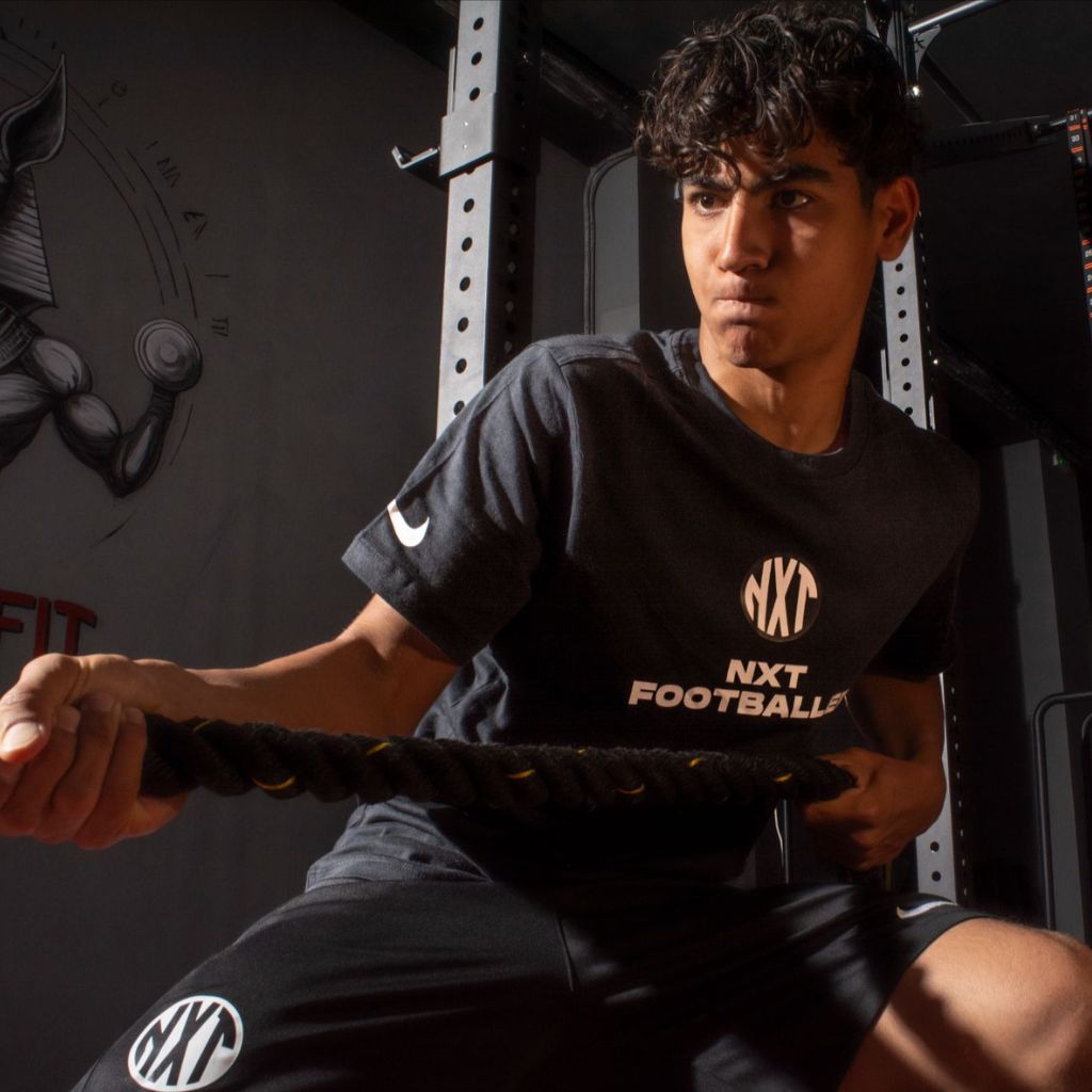 NXT footballer weight training in gym
