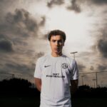 NXT footballer in white uniform outdoor